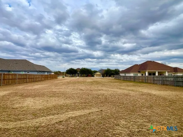 a view of a lake with a big yard