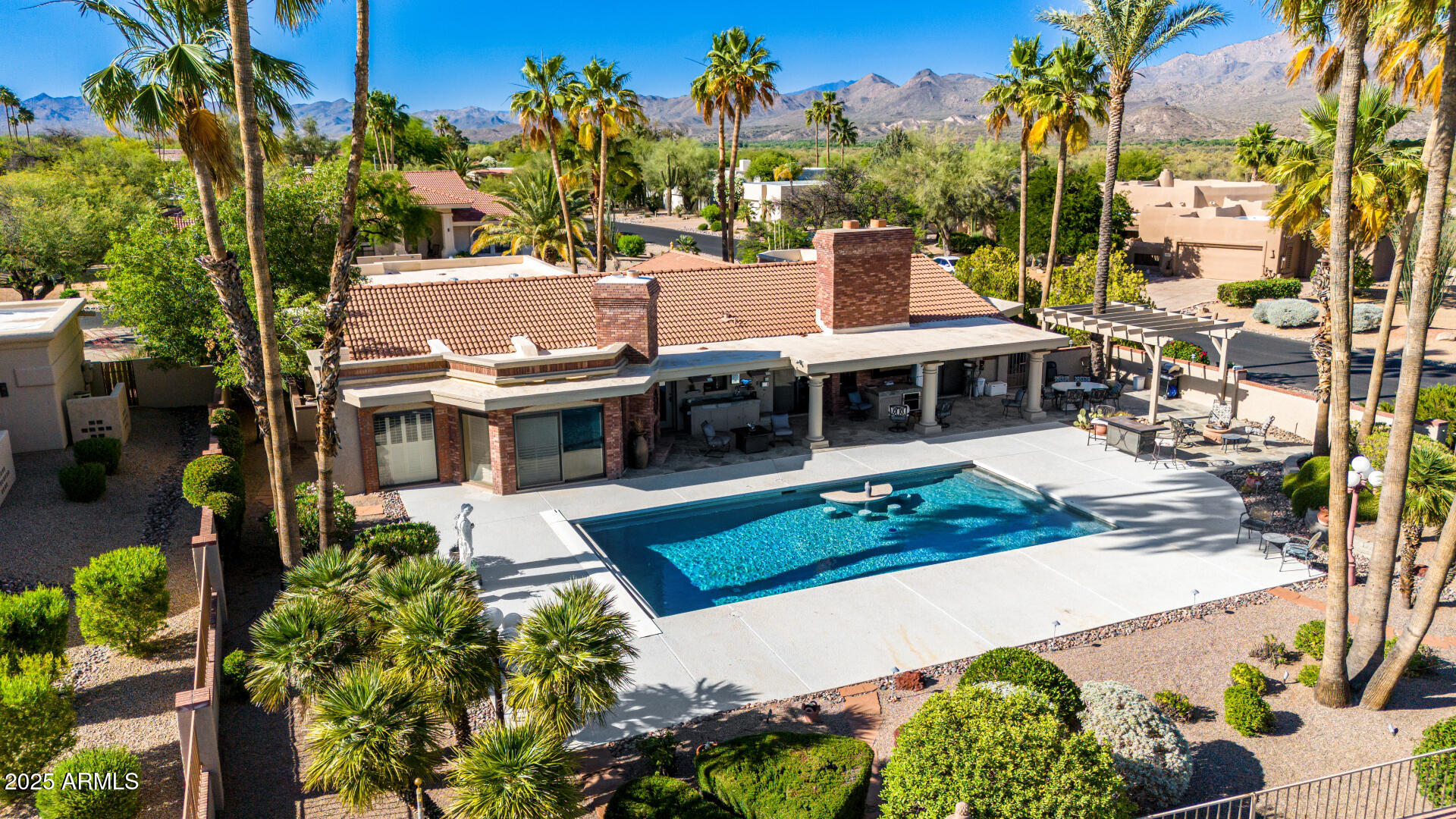 19127 East Wiki Way Rio Verde, AZ 85263 - Photo 1 of 70 an aerial view of a house with a garden and trees