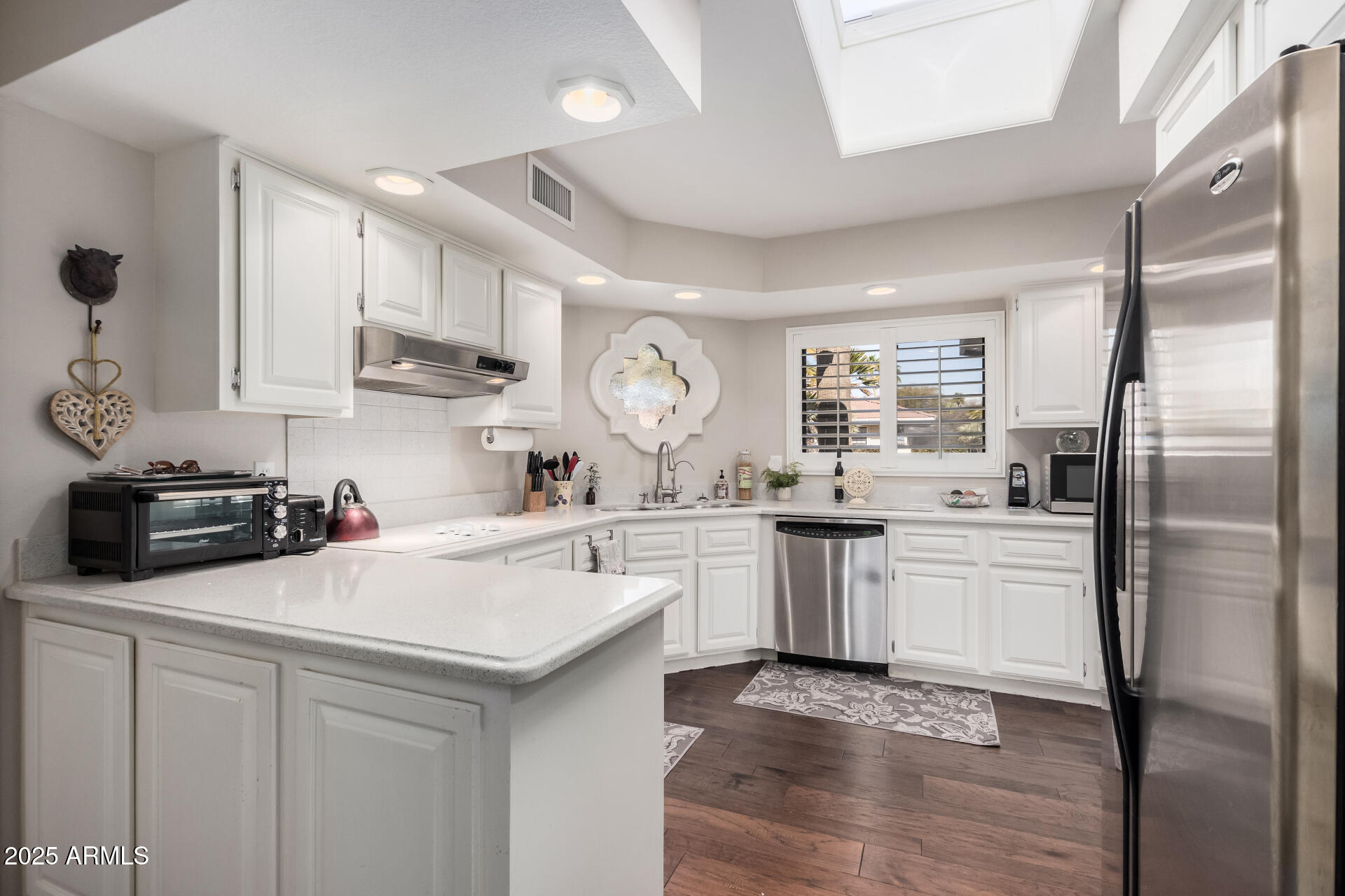 19127 East Wiki Way Rio Verde, AZ 85263 - Photo 20 of 70 a kitchen with a sink cabinets and stainless steel appliances
