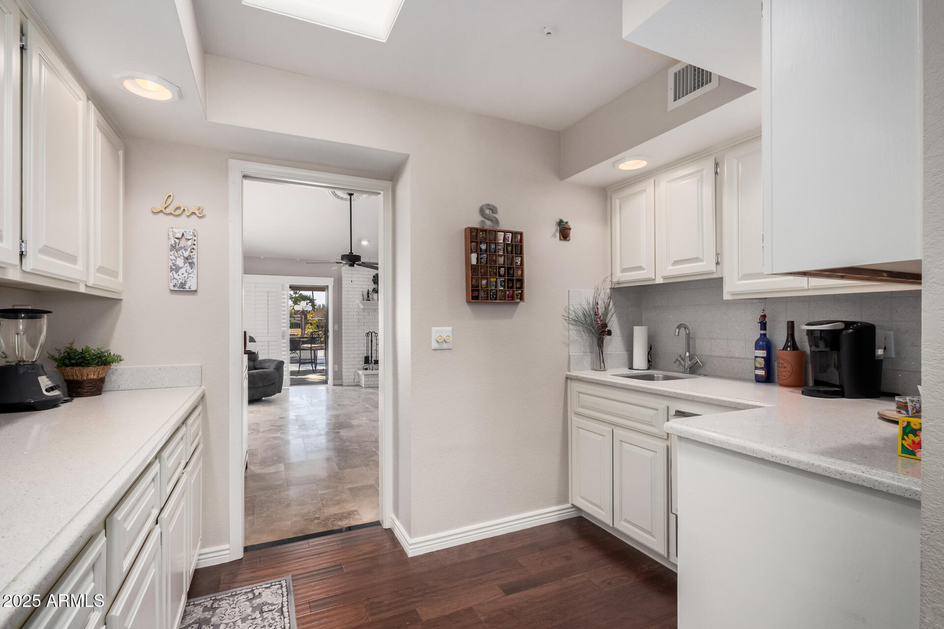 19127 East Wiki Way Rio Verde, AZ 85263 - Photo 21 of 70 a kitchen with stainless steel appliances a sink a stove a refrigerator and cabinets