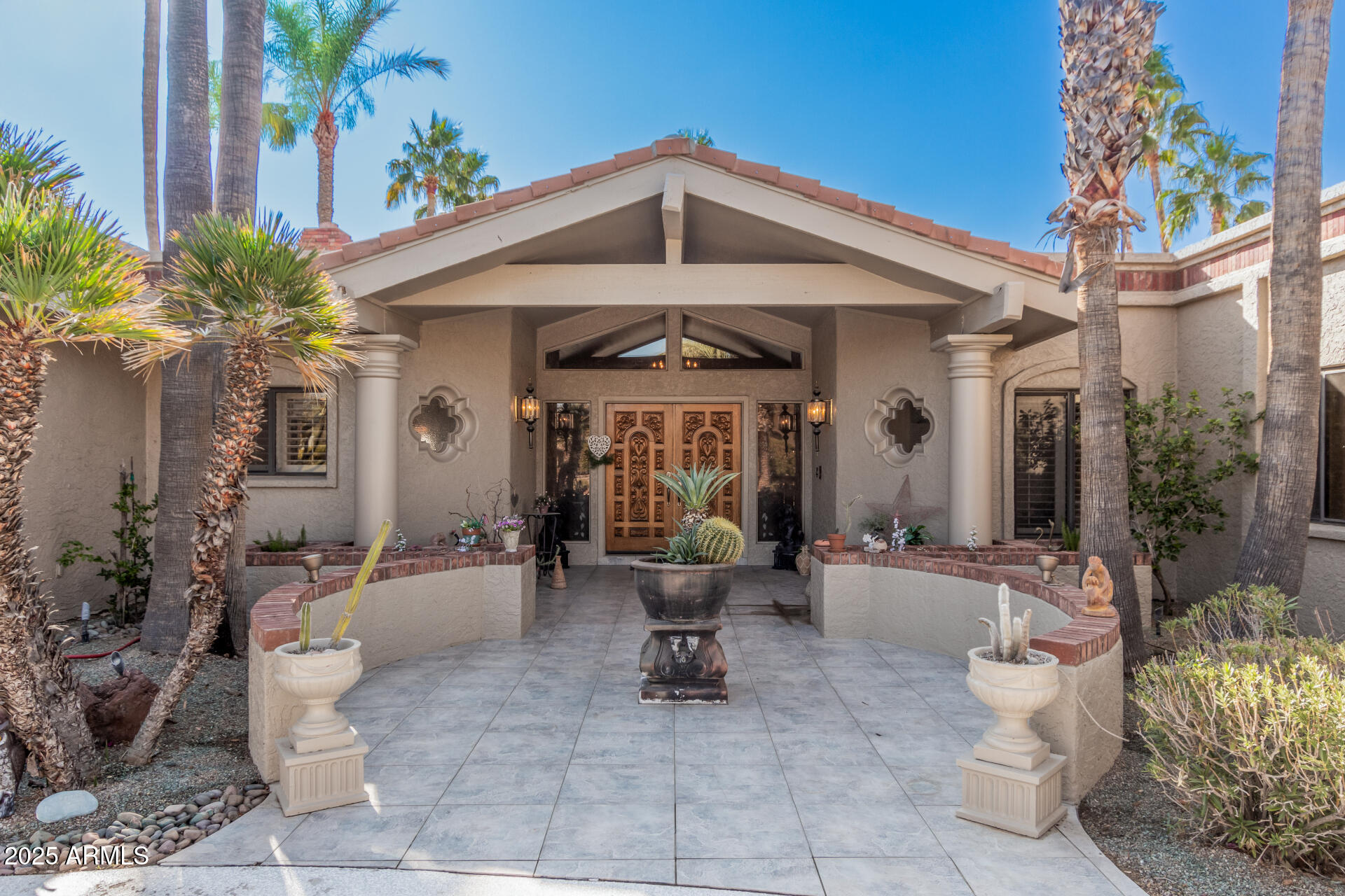 19127 East Wiki Way Rio Verde, AZ 85263 - Photo 3 of 70 a front view of a house with outdoor seating