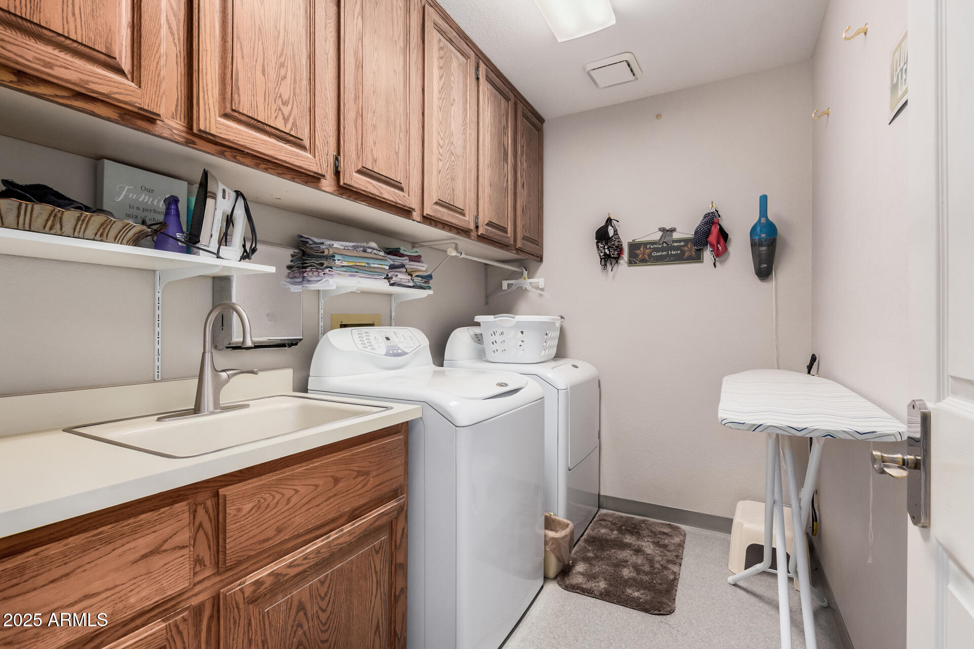 19127 East Wiki Way Rio Verde, AZ 85263 - Photo 40 of 70 a kitchen with a sink a stove and cabinets