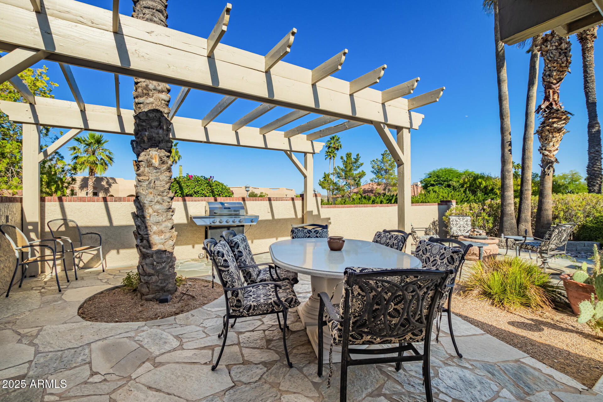 19127 East Wiki Way Rio Verde, AZ 85263 - Photo 47 of 70 a view of a dinning table and chairs in the patio