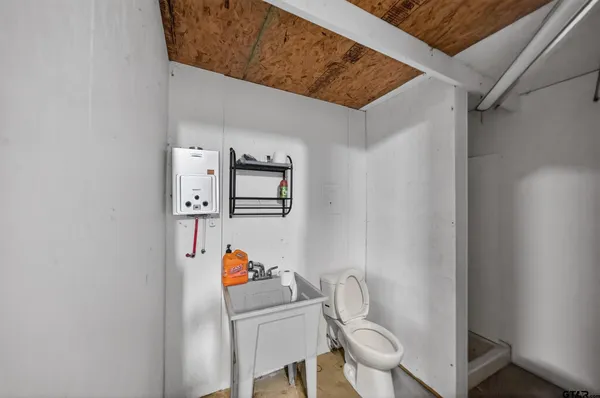 a bathroom with a toilet and a sink