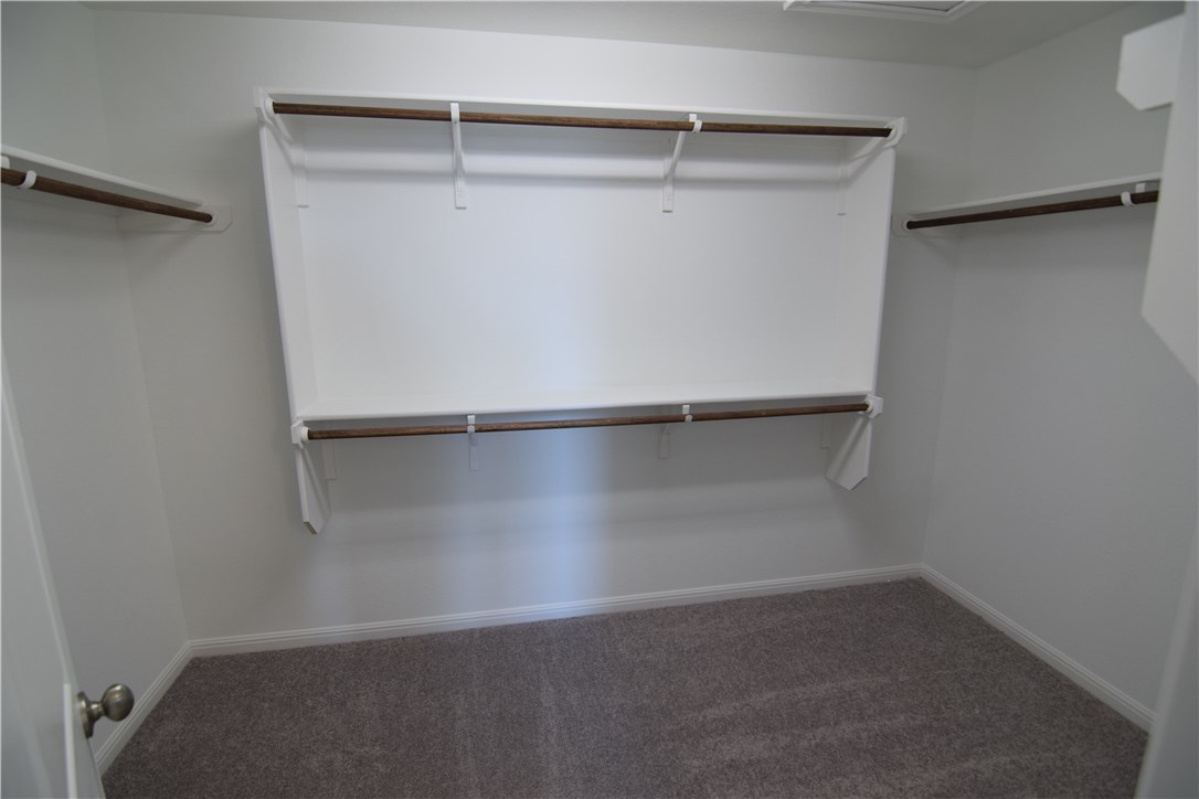 6705 Routenburn Street Austin, TX 78754 - Photo 11 of 18 a view of an empty walk in closet