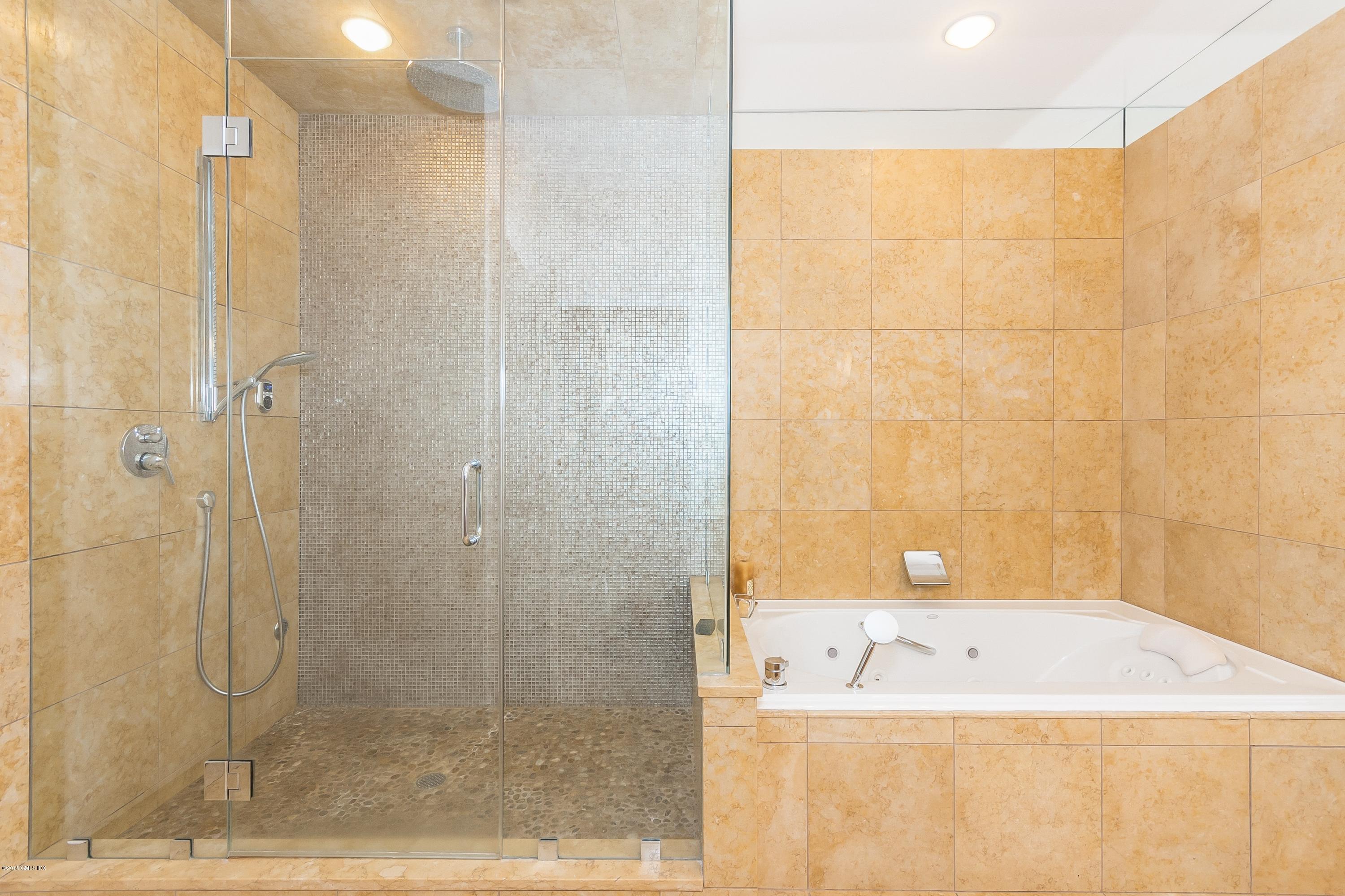 36 Brookridge Drive Greenwich, CT 06830 - Photo 16 of 24 a bathroom with a bathtub and shower