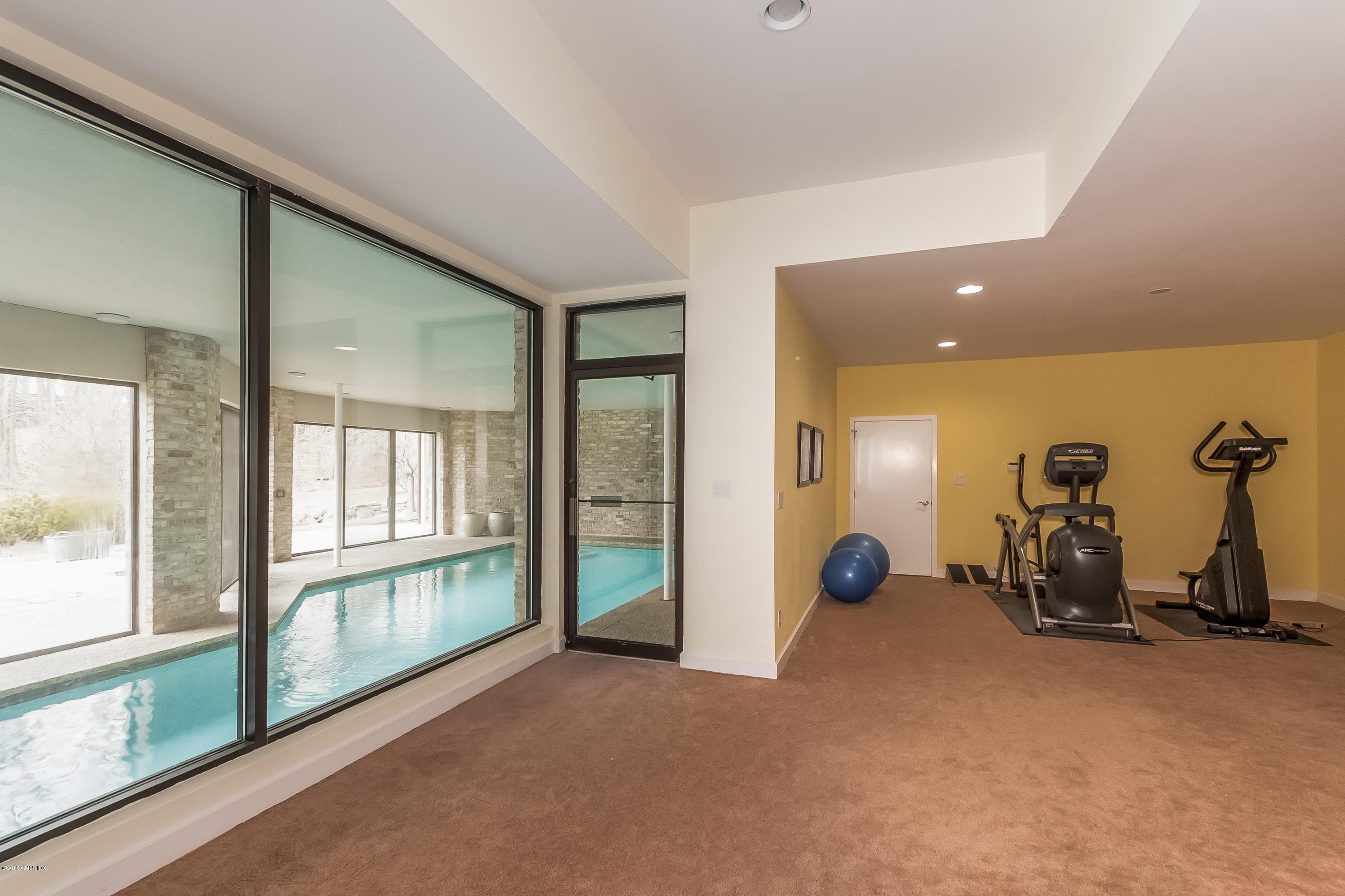 36 Brookridge Drive Greenwich, CT 06830 - Photo 21 of 24 a view of a room with gym equipment