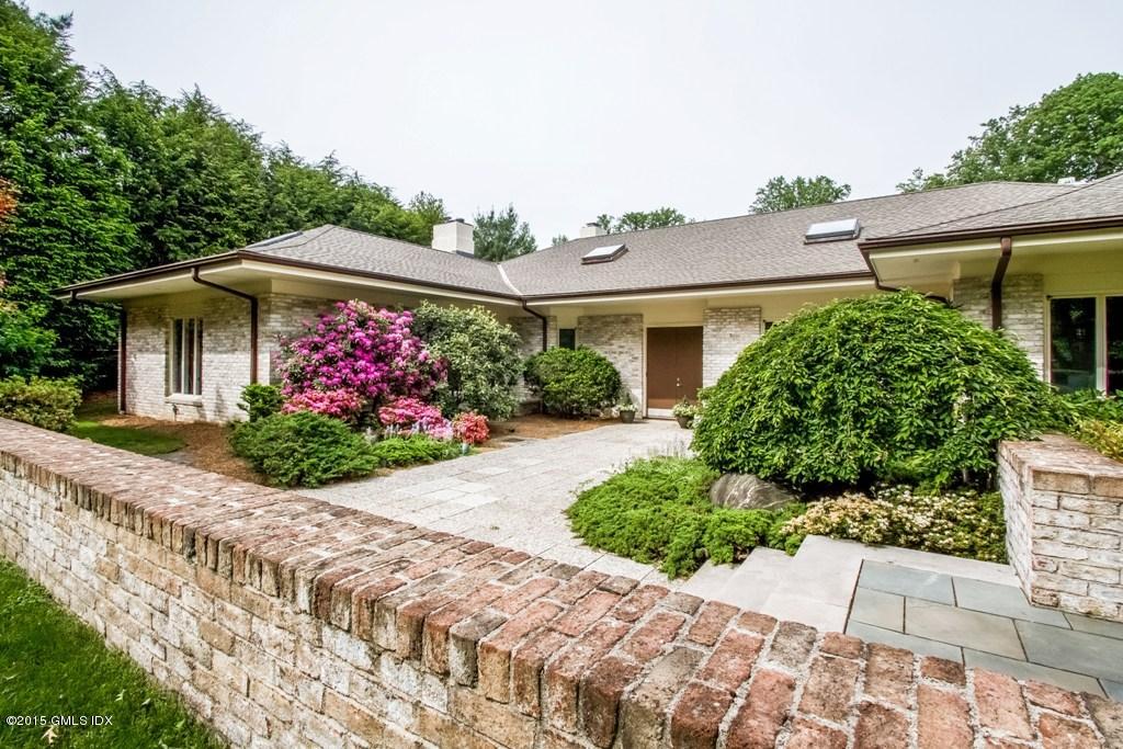 36 Brookridge Drive Greenwich, CT 06830 - Photo 3 of 24 front view of a house with a yard