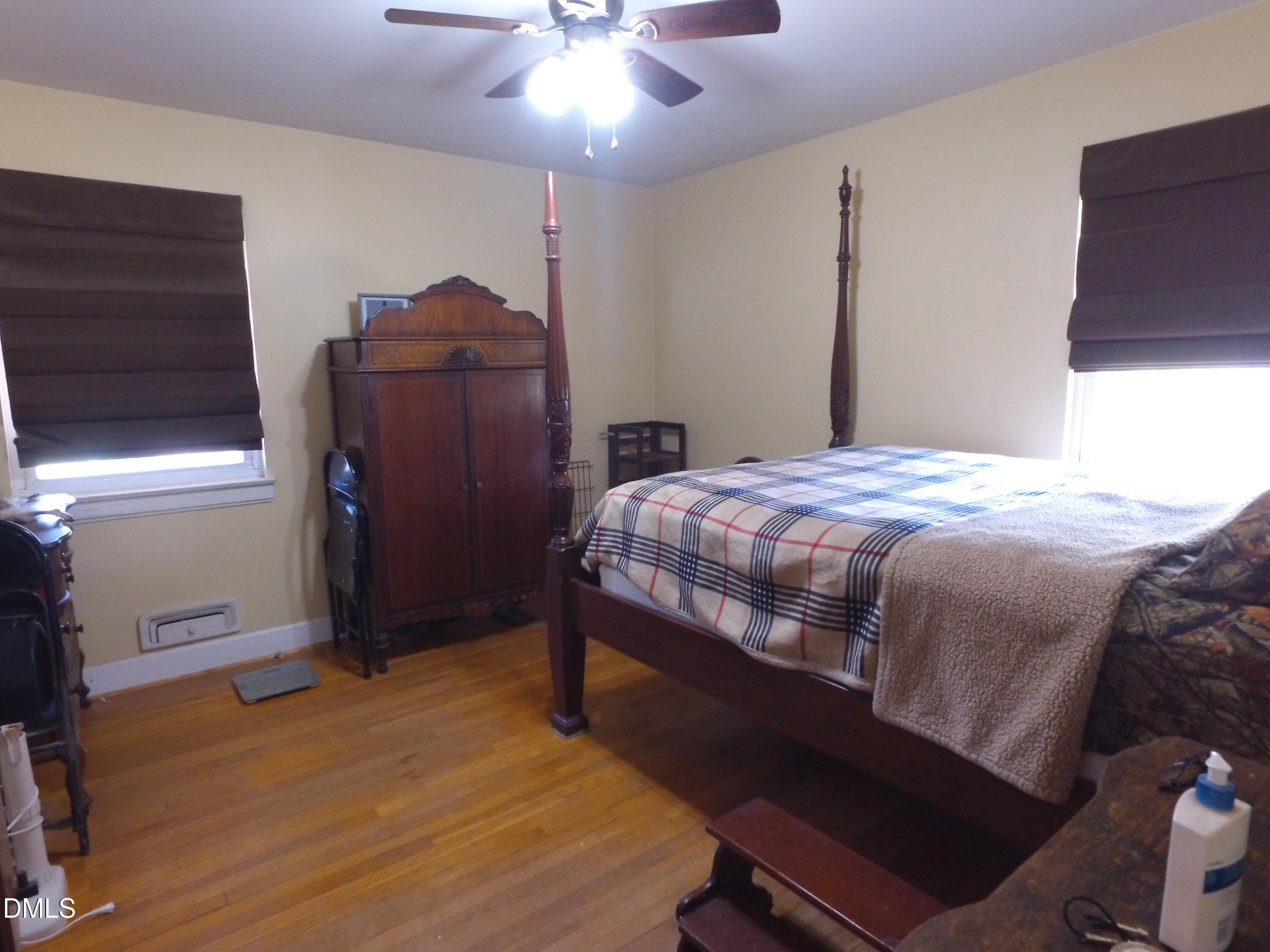 2917 Redwood Road Durham, NC 27704 - Photo 10 of 11 a bedroom with a bed and cabinets