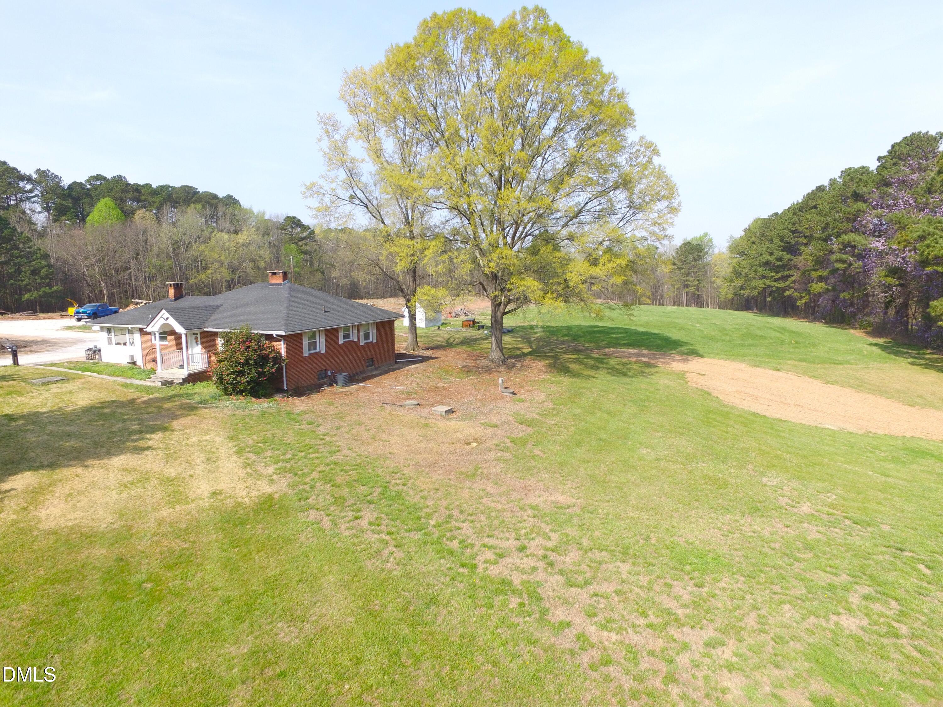 2917 Redwood Road Durham, NC 27704 - Photo 4 of 11 a view of yard with swimming pool and trees in the background