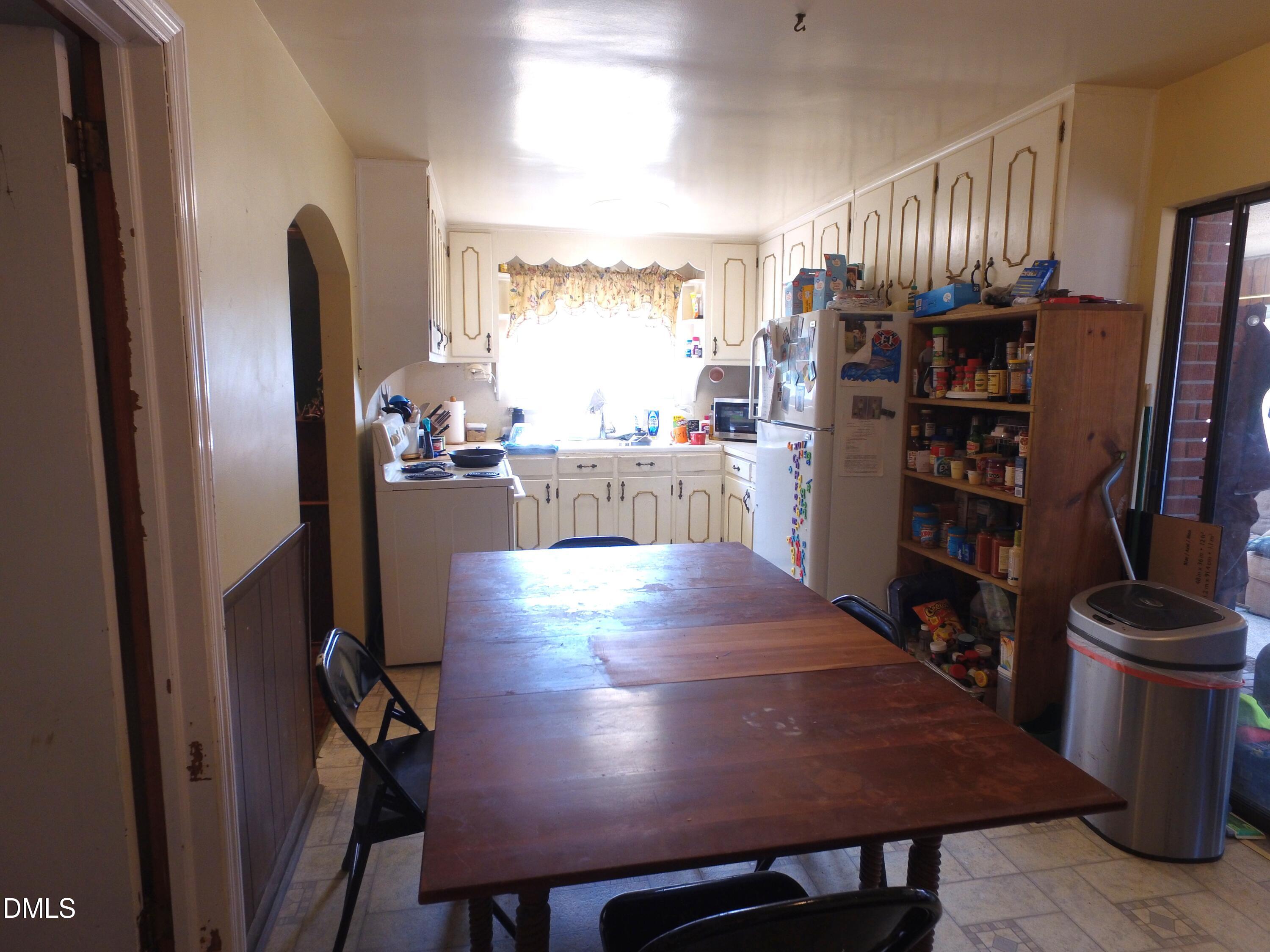2917 Redwood Road Durham, NC 27704 - Photo 7 of 11 a view of kitchen with furniture and wooden floor