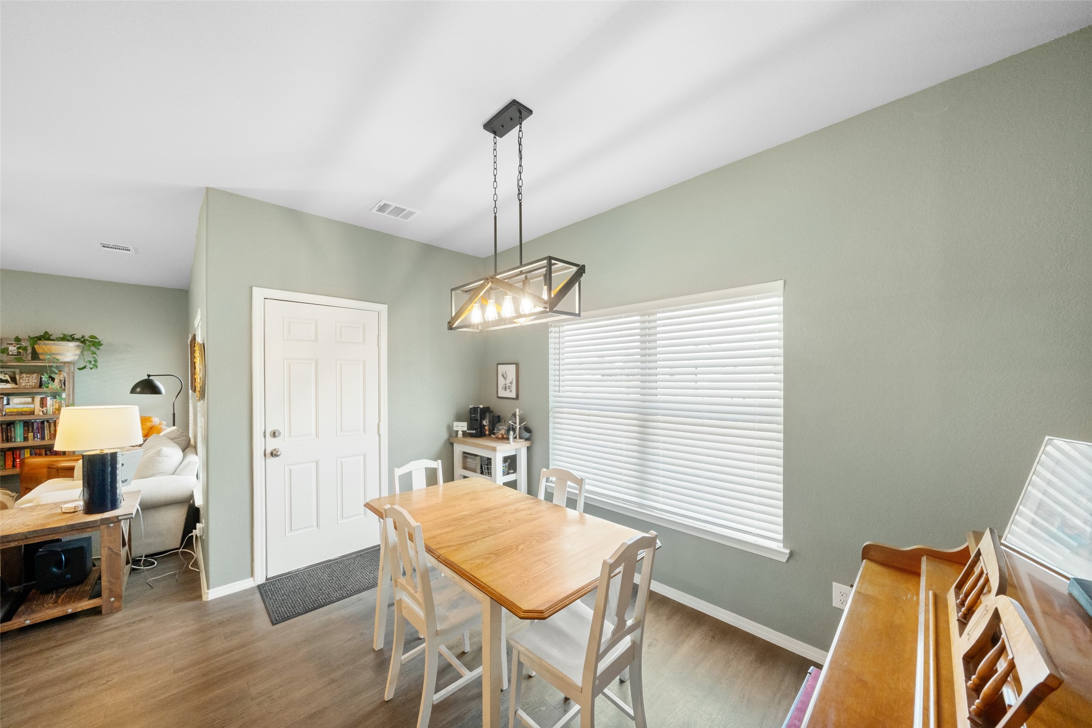 819 Faison Court Montgomery, TX 77316 - Photo 16 of 28 a view of a dining room with furniture window and wooden floor