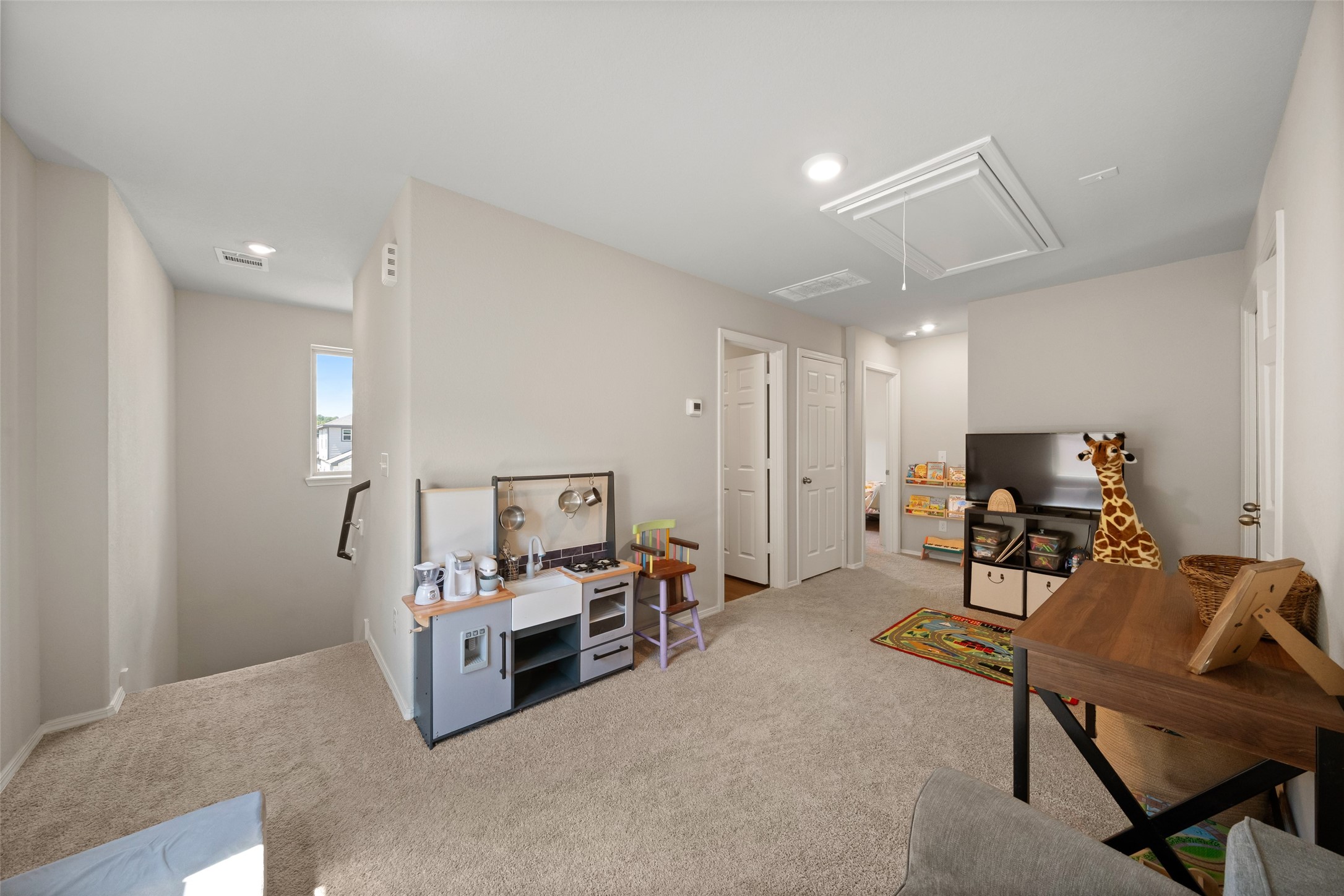 819 Faison Court Montgomery, TX 77316 - Photo 17 of 28 a bedroom with furniture and a chandelier