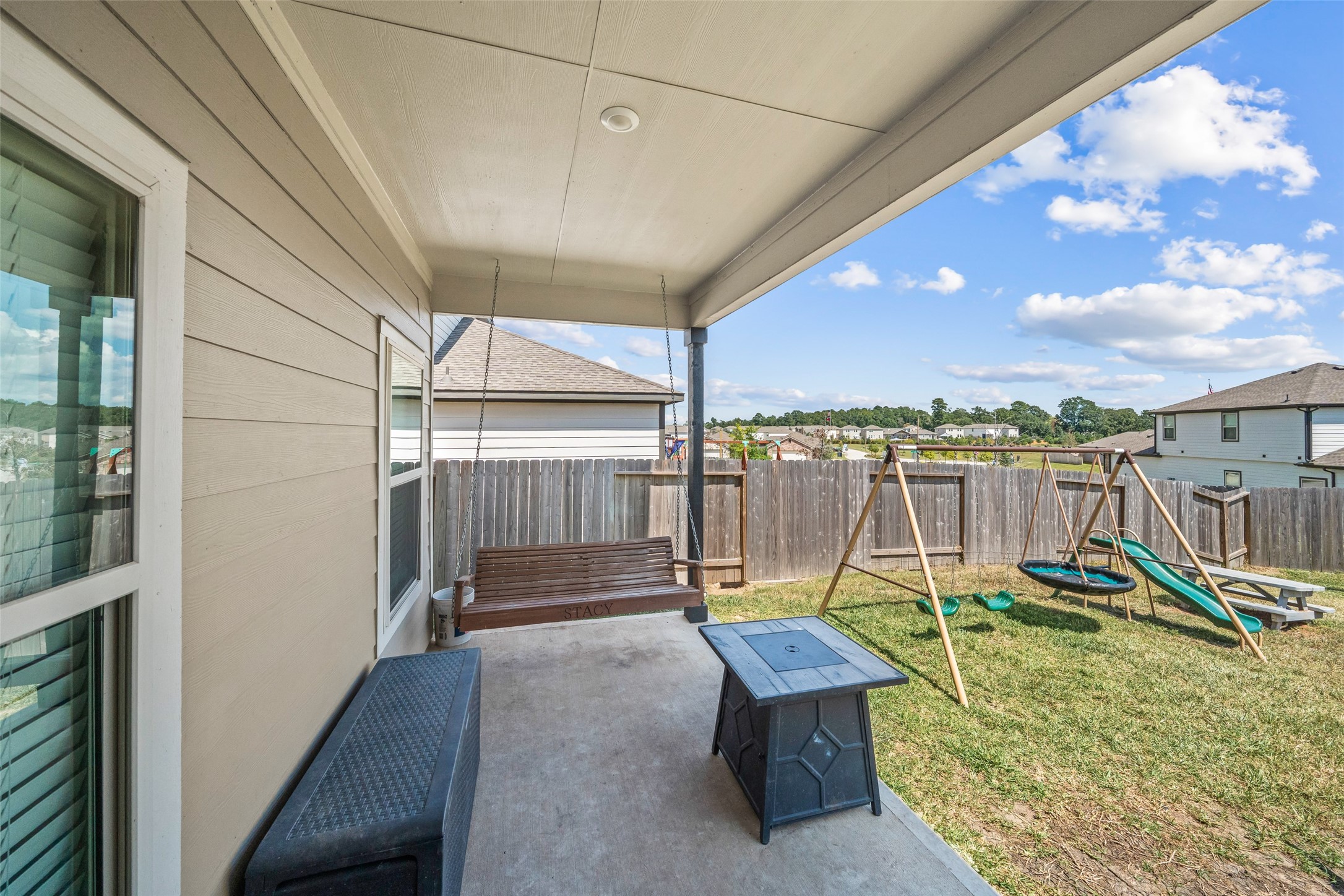 819 Faison Court Montgomery, TX 77316 - Photo 25 of 28 a view of a backyard with a patio