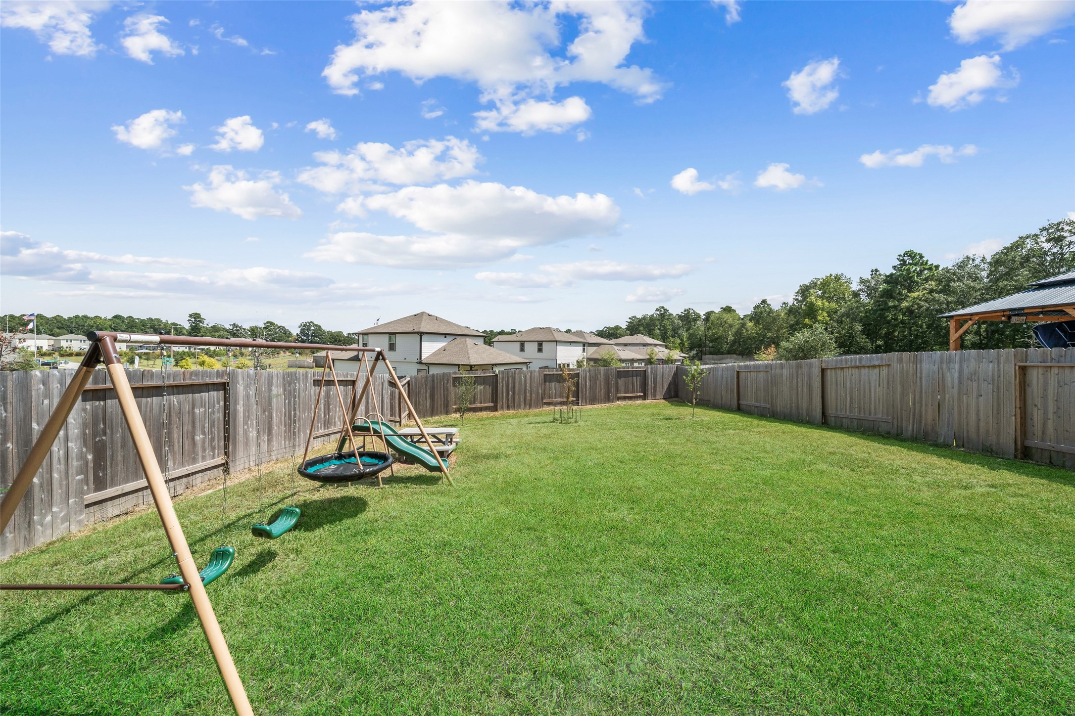 819 Faison Court Montgomery, TX 77316 - Photo 26 of 28 a view of a park with swings