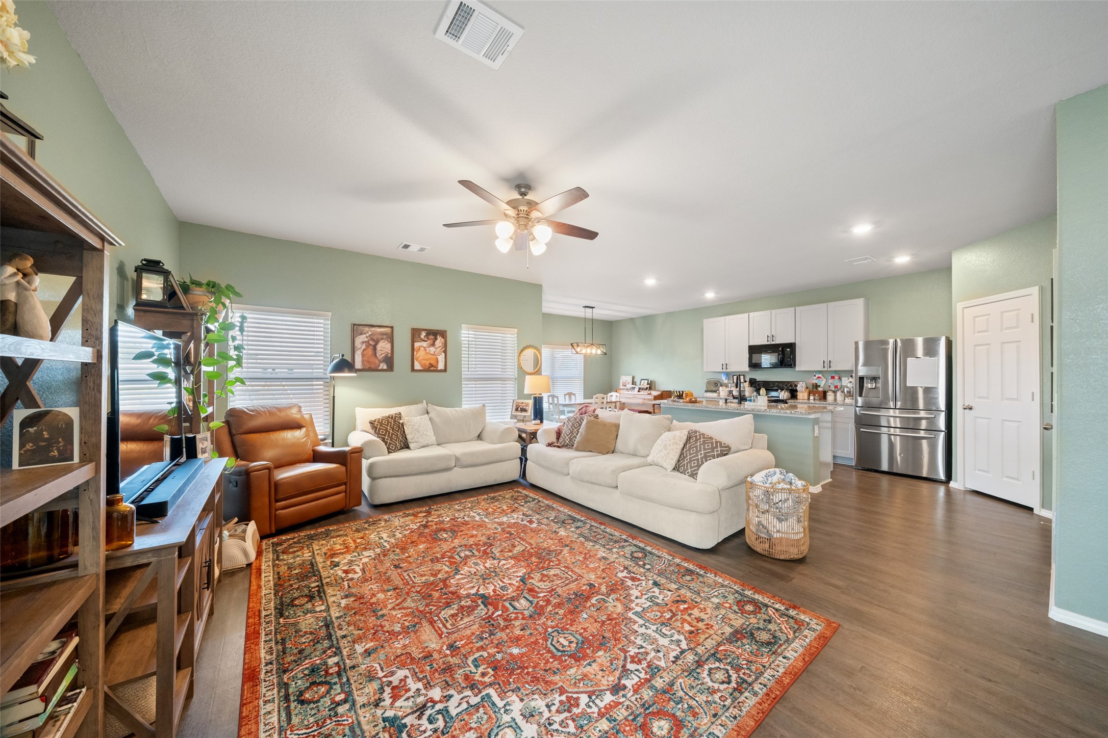 819 Faison Court Montgomery, TX 77316 - Photo 5 of 28 a living room with furniture kitchen view and a large window
