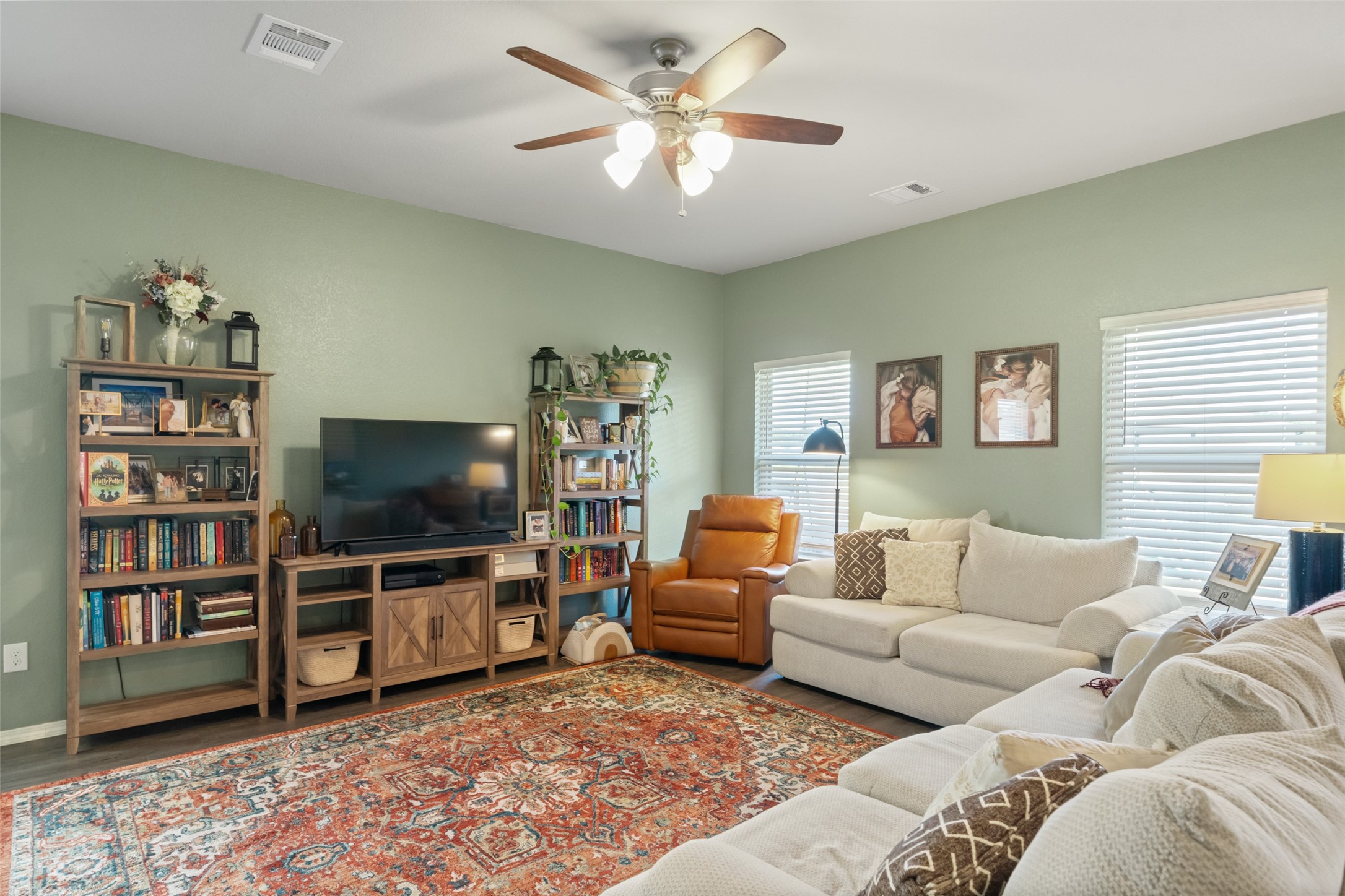 819 Faison Court Montgomery, TX 77316 - Photo 9 of 28 a living room with furniture and a flat screen tv