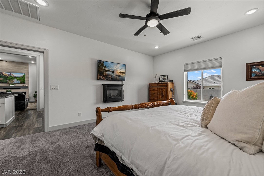 3020 Hannig Street Logandale, NV 89021 - Photo 40 of 75 Well-lit sleeping quarters with plush carpeting and a convenient window provides a comfortable retreat.