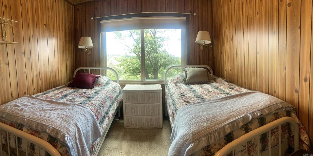 719 Boiling Springs Road Mount Laguna, CA 91948 - Photo 5 of 5 a bedroom with a bed and a window