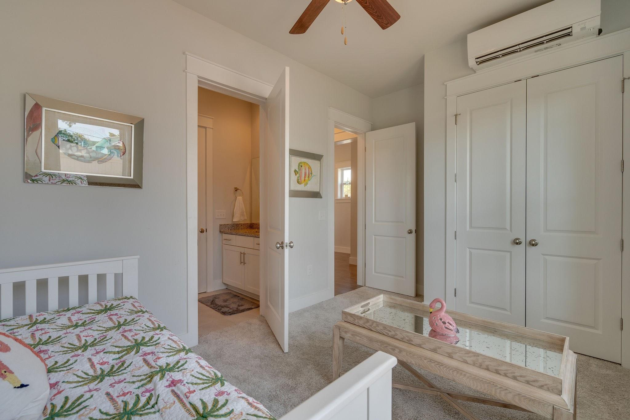 157 Valdare Ln Inlet Beach Inlet Beach, FL 32461 - Photo 11 of 71 a bedroom with a bed and a chandelier