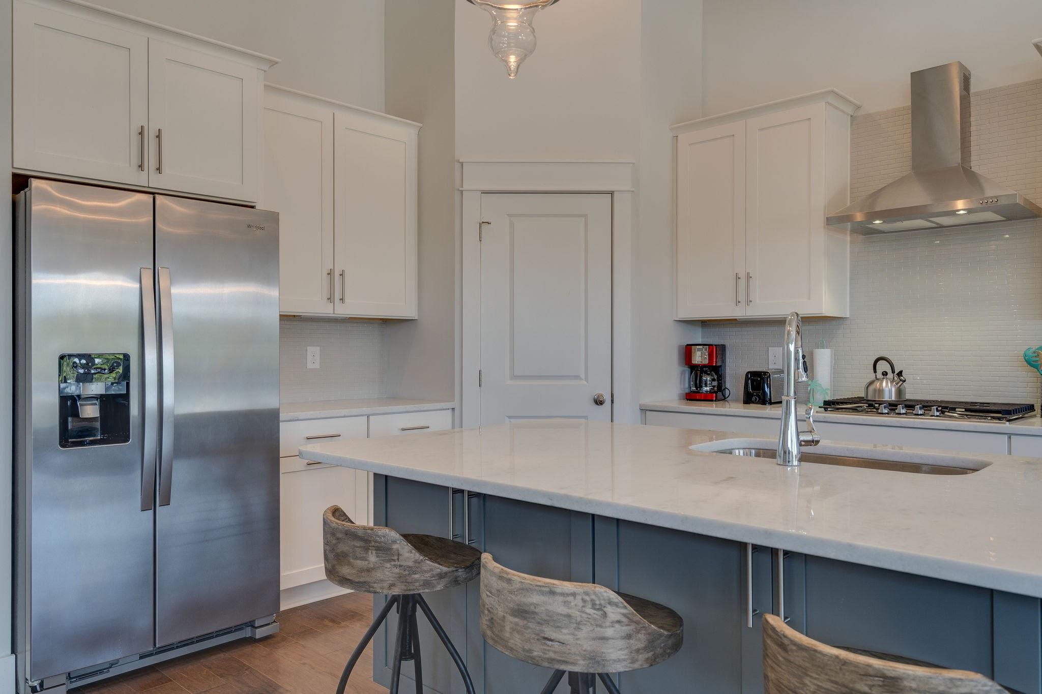 157 Valdare Ln Inlet Beach Inlet Beach, FL 32461 - Photo 23 of 71 a kitchen with stainless steel appliances a sink a stove and refrigerator