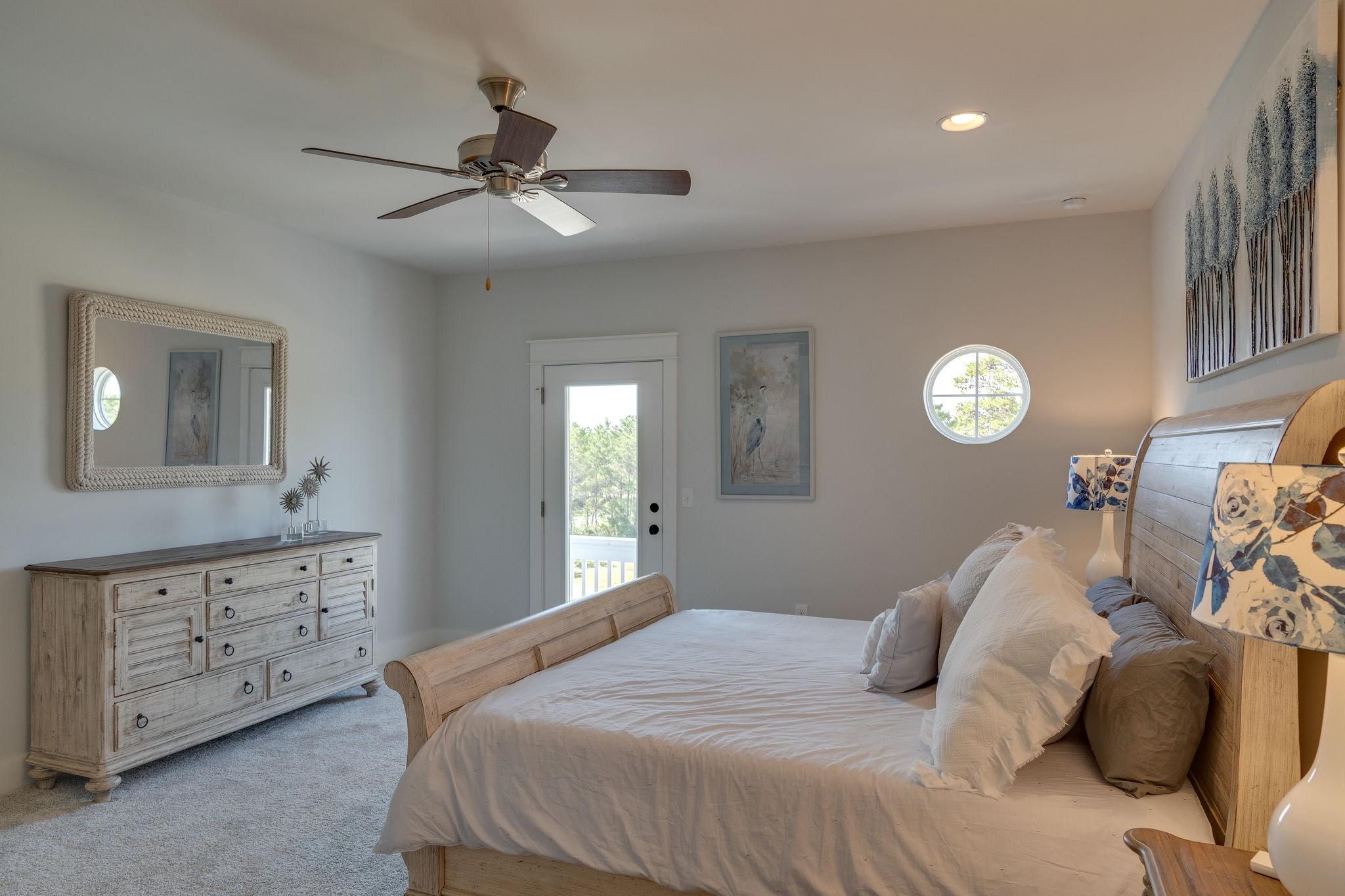 157 Valdare Ln Inlet Beach Inlet Beach, FL 32461 - Photo 47 of 71 a bedroom with a bed and a chandelier