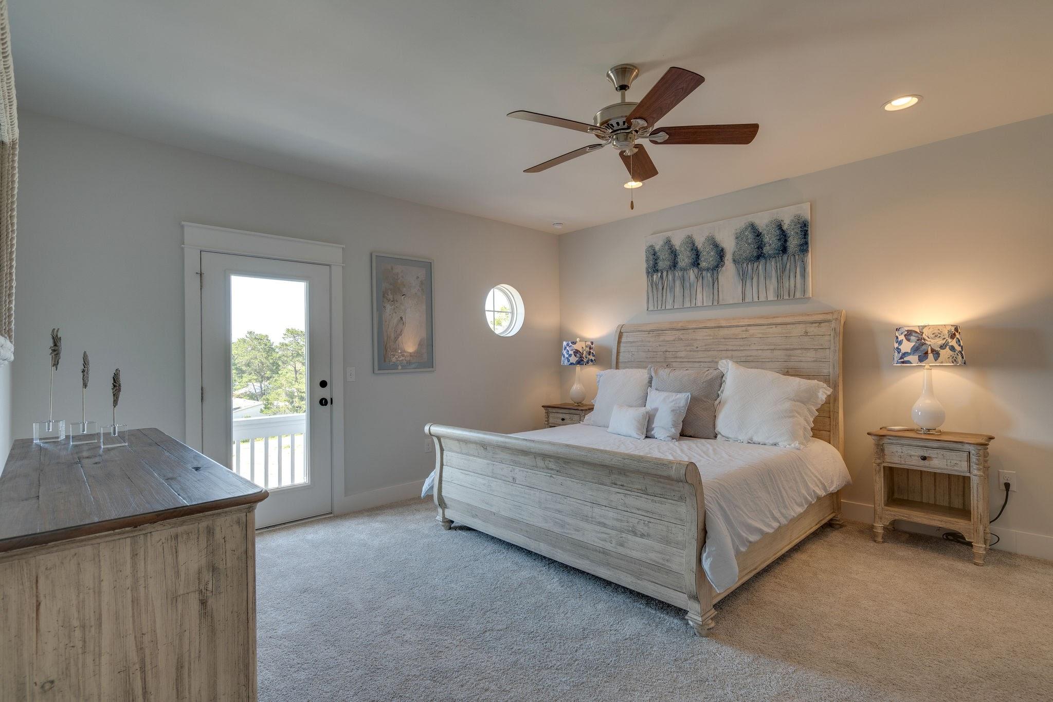 157 Valdare Ln Inlet Beach Inlet Beach, FL 32461 - Photo 48 of 71 a bedroom with a bed and a chandelier