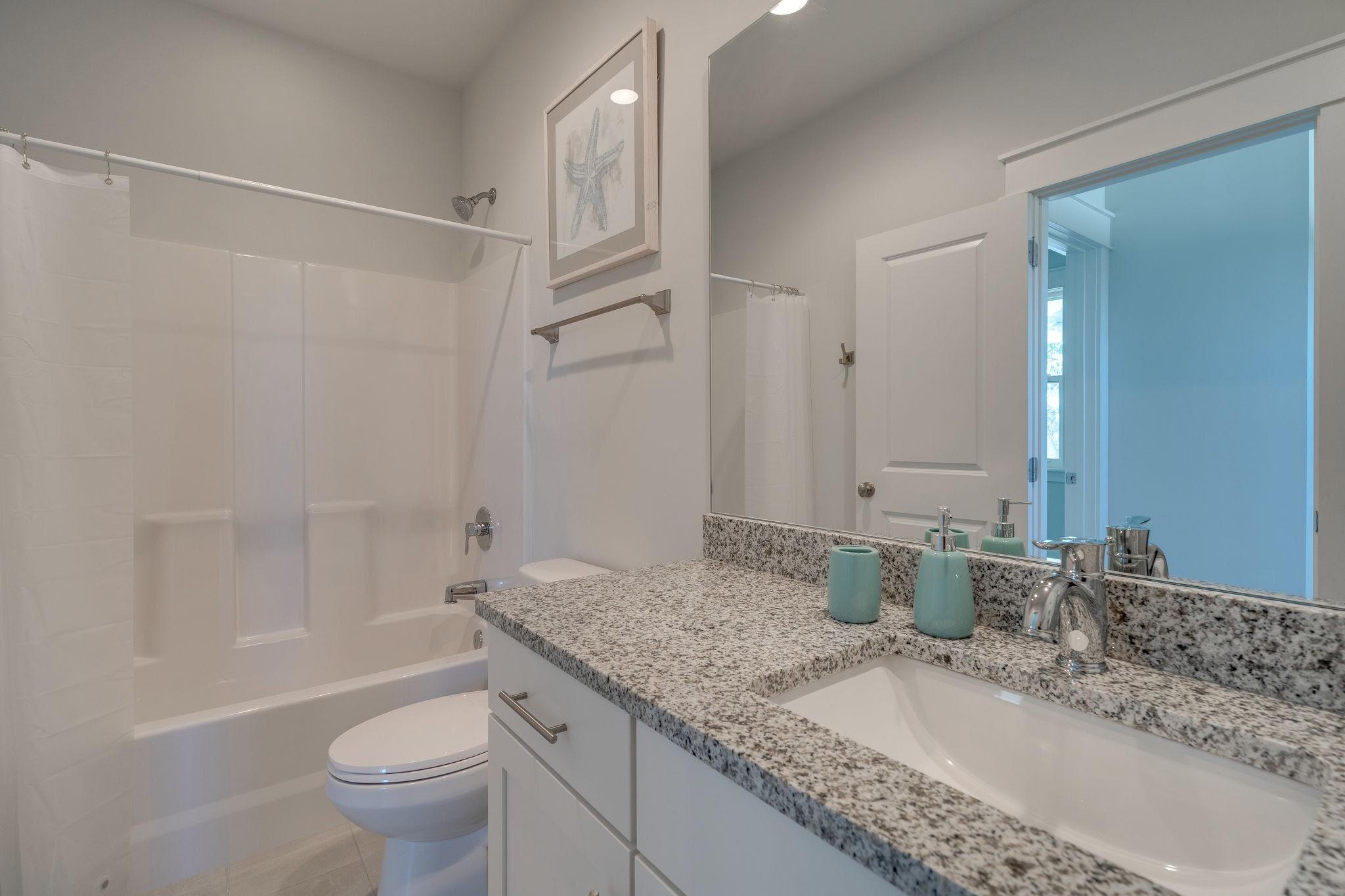157 Valdare Ln Inlet Beach Inlet Beach, FL 32461 - Photo 60 of 71 a bathroom with a granite countertop sink a toilet and shower