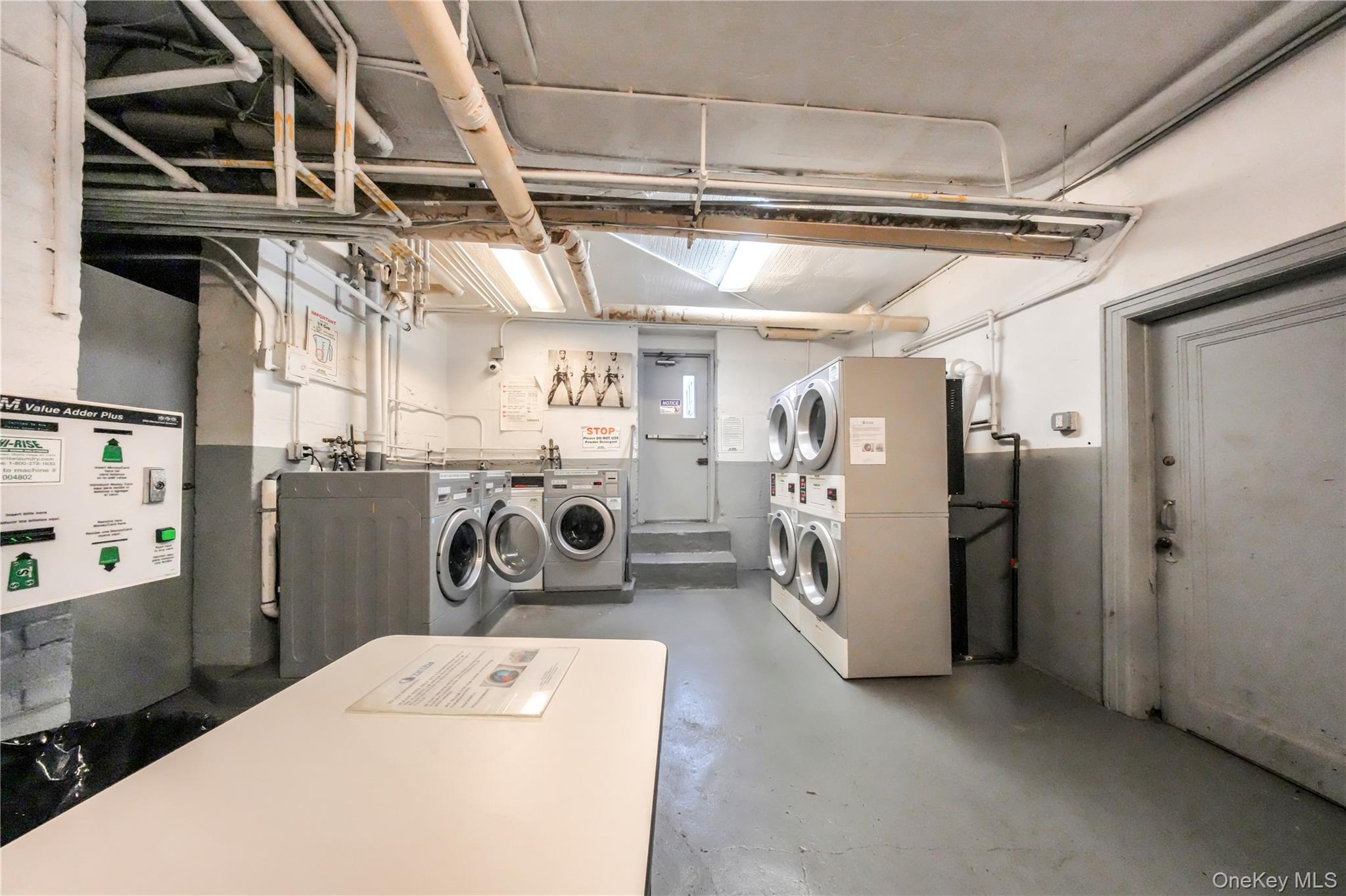 31-14 Crescent Street, Unit 5B Queens, NY 11106 - Photo 14 of 16 Shared laundry room with stacked washer / dryer and separate washer and dryer
