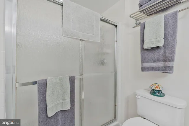 a bathroom with a toilet and shower