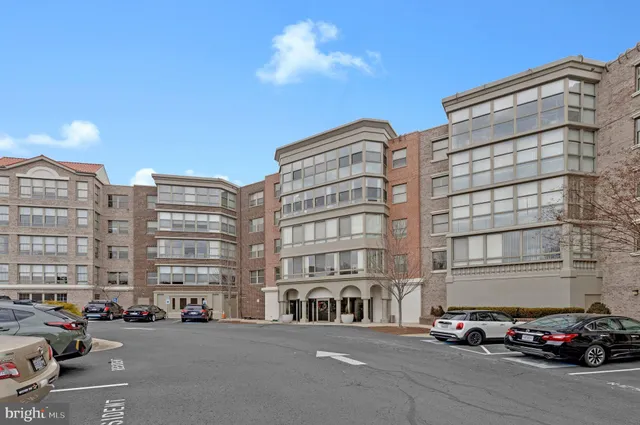 a picture of a bench in front of a building