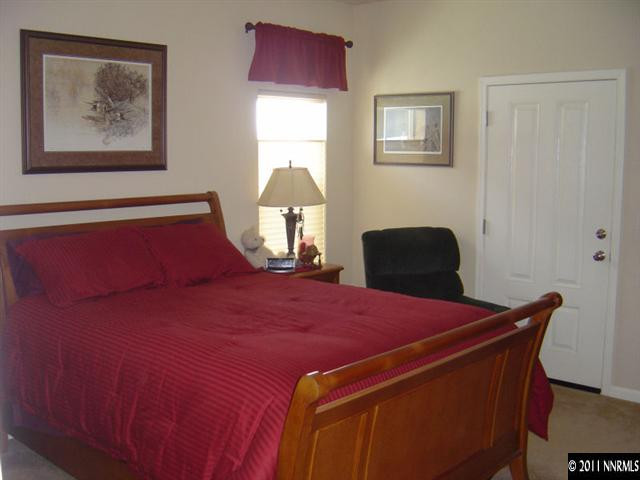2151 Virginia Lake Way Reno, NV 89509 - Photo 6 of 9 a bedroom with a bed and a lamp on dresser