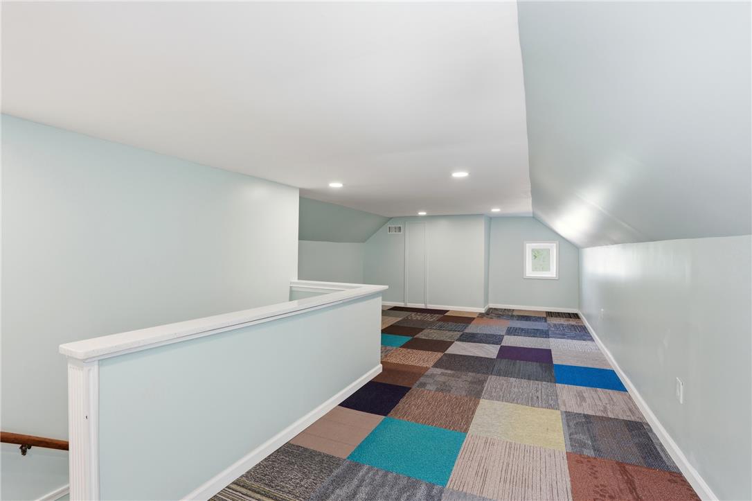 6271 Batman Road Zionsville, PA 18092 - Photo 59 of 100 A vibrant checkered floor adds personality to this versatile attic space, perfect for creative endeavors or extra storage.