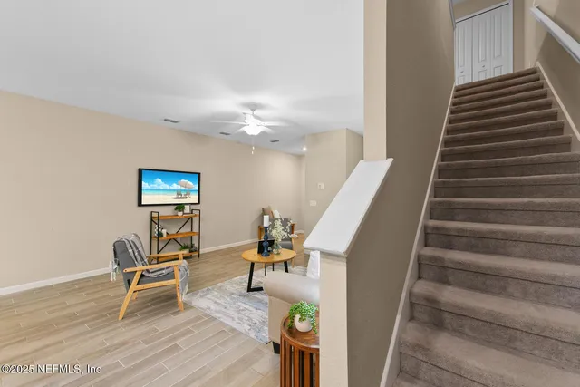 a view of a porch with furniture and a yard