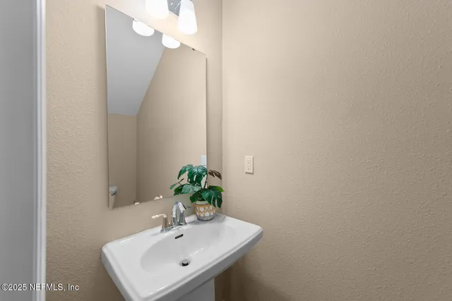 a view of room with window and wooden floor