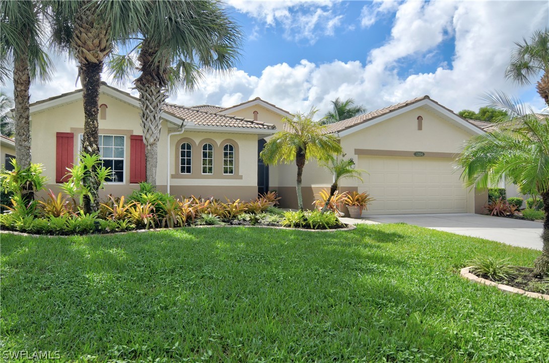 12894 Timber Ridge Drive Fort Myers, FL 33913 - Photo 1 of 25 a front view of house with yard and green space