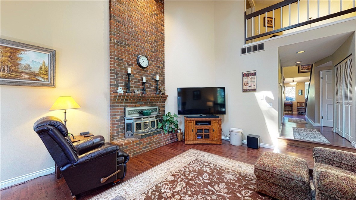 21129 49th Avenue Southeast Bothell, WA 98021 - Photo 14 of 40 a living room with furniture and a flat screen tv