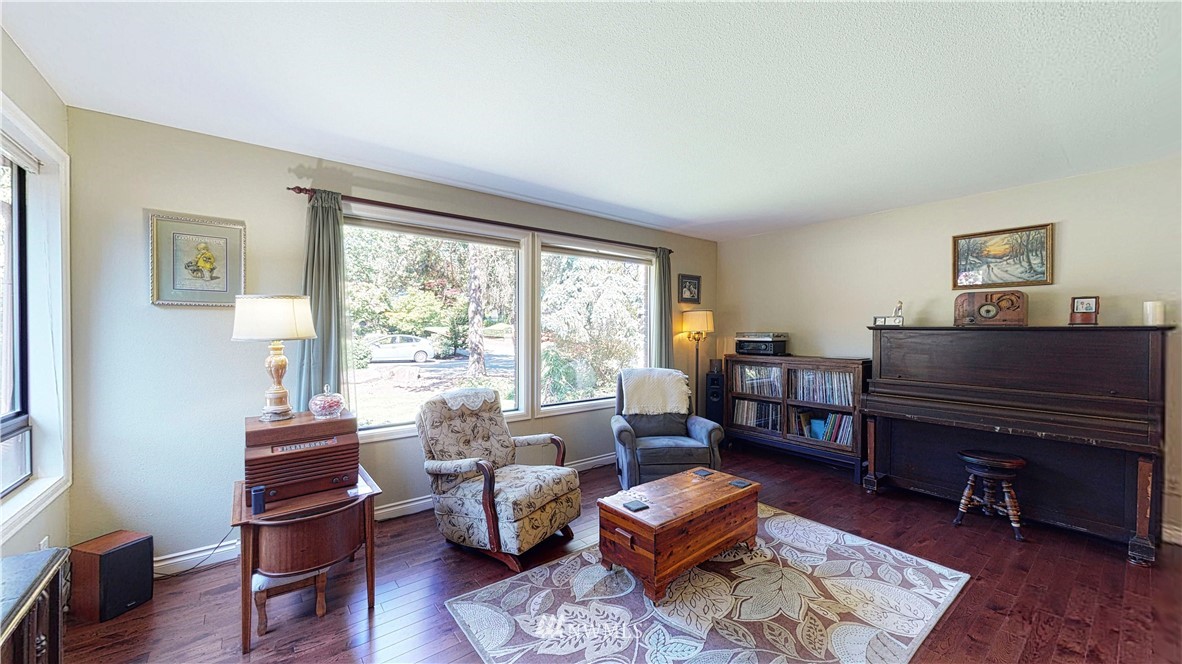 21129 49th Avenue Southeast Bothell, WA 98021 - Photo 3 of 40 a living room with furniture and a wooden floor