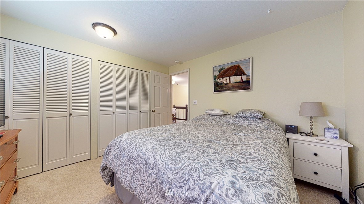 21129 49th Avenue Southeast Bothell, WA 98021 - Photo 29 of 40 a bedroom with a bed and a window