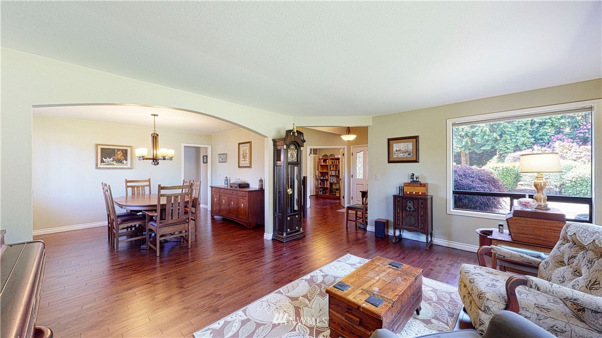 21129 49th Avenue Southeast Bothell, WA 98021 - Photo 4 of 40 a living room with furniture and a wooden floor