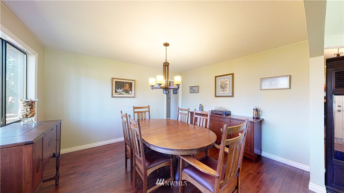 21129 49th Avenue Southeast Bothell, WA 98021 - Photo 5 of 40 a view of a dining room with furniture and wooden floor