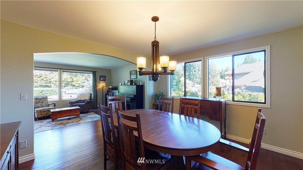 21129 49th Avenue Southeast Bothell, WA 98021 - Photo 6 of 40 a dining room with furniture window wooden floor