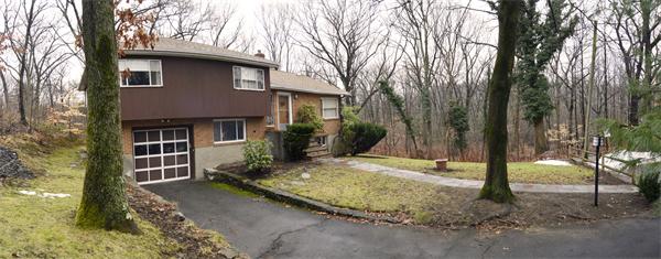 a backyard of a house with lots of green space