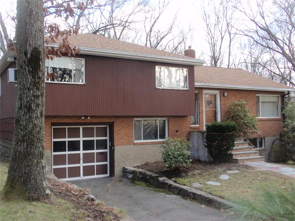 114 Leland Road Boston, MA 02467 - Photo 11 of 22 a front view of a house with a yard