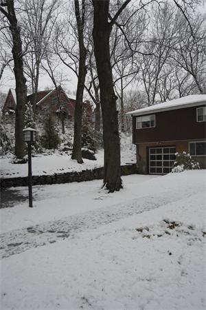 114 Leland Road Boston, MA 02467 - Photo 20 of 22 a view of a house with a snow on the road