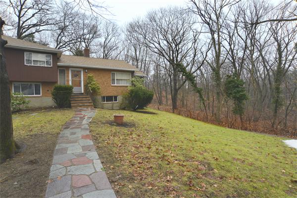 114 Leland Road Boston, MA 02467 - Photo 3 of 22 a backyard of a house with yard and outdoor seating