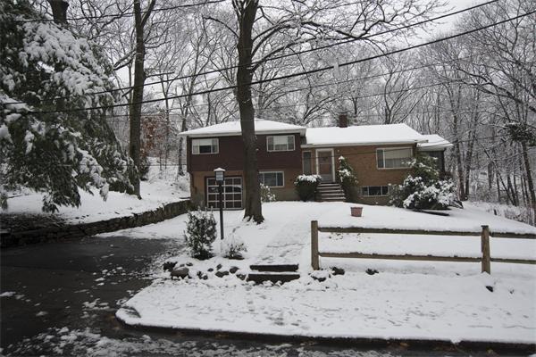 114 Leland Road Boston, MA 02467 - Photo 4 of 22 a view of a house with a snow on the road