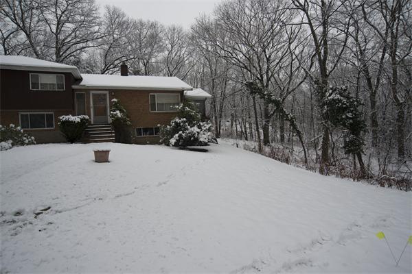 114 Leland Road Boston, MA 02467 - Photo 6 of 22 a view of a house with snow in front of house