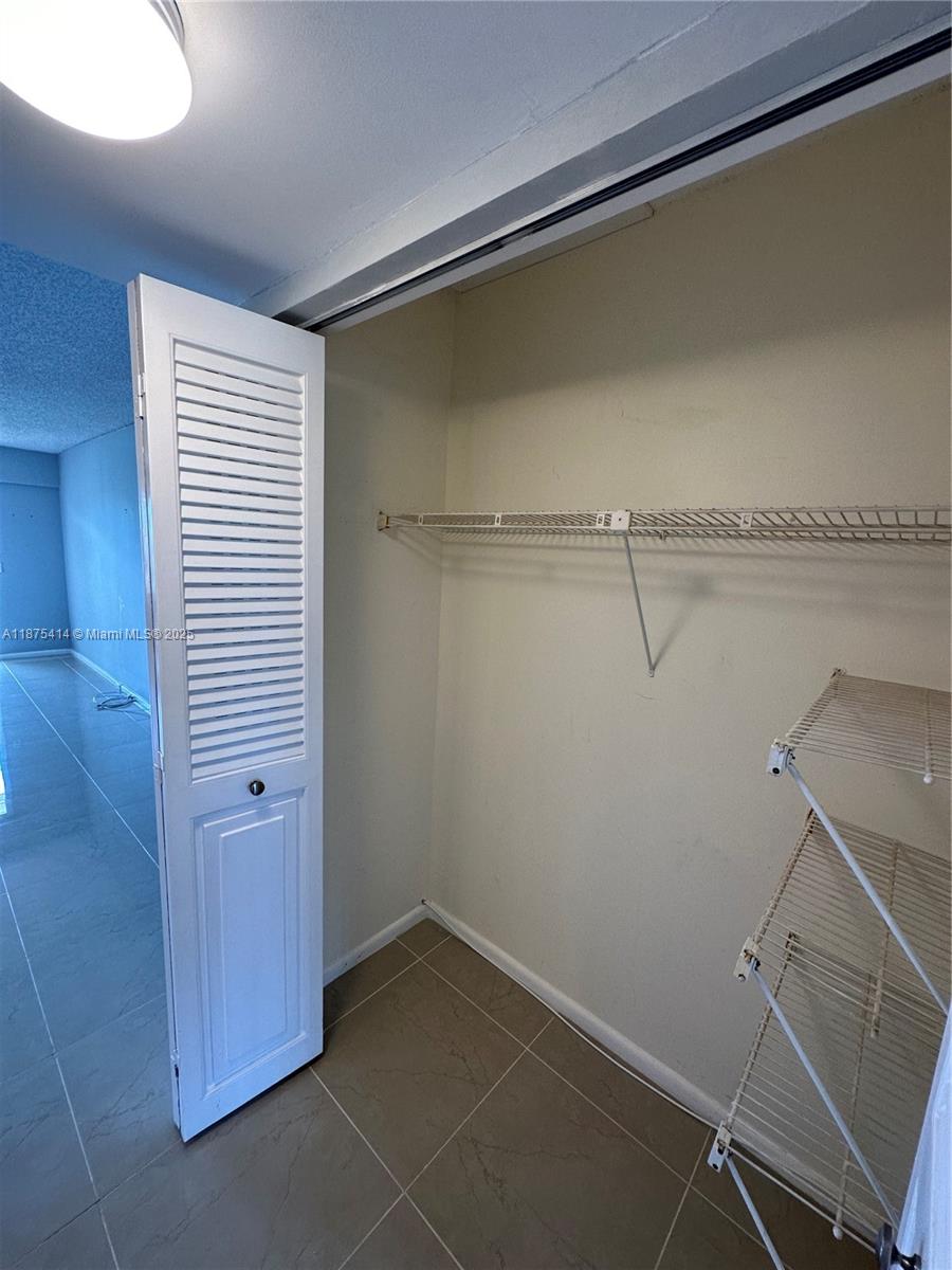 37 Brighton A, Unit 37 Boca Raton, FL 33434 - Photo 14 of 30 a view of a room with racks on the wall