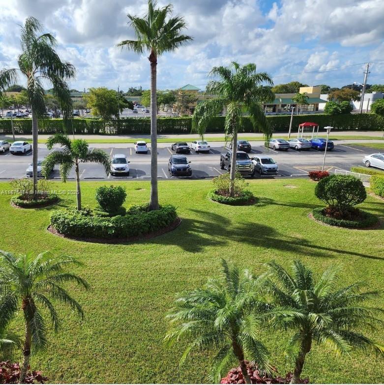 37 Brighton A, Unit 37 Boca Raton, FL 33434 - Photo 15 of 30 a view of a park with swings and slides